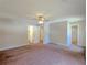 Expansive carpeted bedroom featuring doors to a bathroom and a closet at 2918 Pavia Circle, Austell, GA 30106