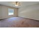Spacious carpeted bedroom with a window and a ceiling fan at 2918 Pavia Circle, Austell, GA 30106