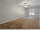 Spacious carpeted bedroom with ceiling fan and a bright window with blinds at 2918 Pavia Circle, Austell, GA 30106