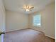 A bedroom with neutral paint, a large window and a ceiling fan at 2918 Pavia Circle, Austell, GA 30106