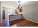 Cozy dining area featuring hardwood floors, a modern chandelier, and an adjacent kitchen at 2918 Pavia Circle, Austell, GA 30106