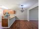 Well-lit dining area featuring hardwood floors, a modern chandelier, and an adjacent kitchen at 2918 Pavia Circle, Austell, GA 30106