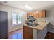 Bright kitchen features stainless steel appliances, light wood cabinets and window at 2918 Pavia Circle, Austell, GA 30106