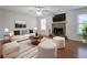 Bright living room featuring a fireplace, hardwood floors, lots of light and neutral-colored furniture at 2918 Pavia Circle, Austell, GA 30106