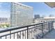 Enjoy city views from this balcony overlooking nearby buildings and bustling streets below at 3040 Peachtree Nw Rd # 1013, Atlanta, GA 30305