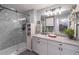 Bathroom featuring a glass enclosed shower, ample storage, and modern fixtures at 3040 Peachtree Nw Rd # 1013, Atlanta, GA 30305