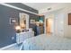 A beautifully decorated bedroom features a gray accent wall, stylish furniture, and elegant decor at 3040 Peachtree Nw Rd # 1013, Atlanta, GA 30305