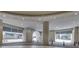 A covered entrance to a building, featuring stone pillars, recessed lighting, and brick-lined pathways at 3040 Peachtree Nw Rd # 1013, Atlanta, GA 30305