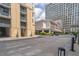 An exterior view of a luxurious building, showing its architecture and surrounding landscape in an urban setting at 3040 Peachtree Nw Rd # 1013, Atlanta, GA 30305