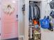 Entryway with pink door and coat closet showing clothing and cleaning supplies at 3040 Peachtree Nw Rd # 1013, Atlanta, GA 30305