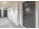 Hallway leading to unit number 1013 with a door and apartment number sign at 3040 Peachtree Nw Rd # 1013, Atlanta, GA 30305