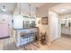 A modern kitchen with a breakfast bar, stainless steel appliances, and light wood floors creates an inviting space at 3040 Peachtree Nw Rd # 1013, Atlanta, GA 30305