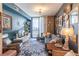 Comfortable living room featuring a modern sectional, city views, and stylish decor at 3040 Peachtree Nw Rd # 1013, Atlanta, GA 30305