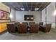 A media room with comfortable seating, a large TV screen, and ambient lighting at 3040 Peachtree Nw Rd # 1013, Atlanta, GA 30305