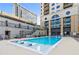Relaxing pool area with lounge chairs and shallow water feature at 3040 Peachtree Nw Rd # 1013, Atlanta, GA 30305
