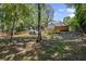 Spacious backyard featuring a wooden deck and a partially covered area, perfect for outdoor entertaining at 4038 Sharon Woods Dr, Powder Springs, GA 30127
