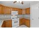A well-lit kitchen featuring stainless steel appliances and gray backsplash at 4038 Sharon Woods Dr, Powder Springs, GA 30127