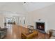 Spacious living room with hardwood floors, a fireplace, and lots of natural light at 4038 Sharon Woods Dr, Powder Springs, GA 30127