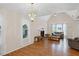 Bright living room features hardwood floors, fireplace, and open layout creating a cozy and inviting space at 4038 Sharon Woods Dr, Powder Springs, GA 30127