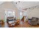 Inviting living room with vaulted ceilings, staircase, and natural light offers a comfortable and spacious environment at 4038 Sharon Woods Dr, Powder Springs, GA 30127