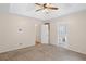 Spacious main bedroom featuring plush carpet, ceiling fan, and access to the ensuite bathroom at 4038 Sharon Woods Dr, Powder Springs, GA 30127