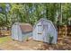 Backyard with two storage sheds providing ample space for gardening tools and outdoor equipment at 4038 Sharon Woods Dr, Powder Springs, GA 30127