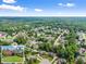 Stunning aerial view of the neighborhood showcasing the home's location within a lush, green community at 4955 Winding Rose Dr, Suwanee, GA 30024