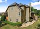 View of the backyard with a multi-level deck, lawn, and mature landscaping at 4955 Winding Rose Dr, Suwanee, GA 30024
