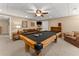 Finished basement featuring a pool table, sofa, bookcase and carpet, perfect for fun at 4955 Winding Rose Dr, Suwanee, GA 30024