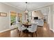 Cozy dining area with access to a covered porch at 4955 Winding Rose Dr, Suwanee, GA 30024