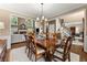Formal dining room showcasing a wood table, chairs, and hardwood floors providing a grand setting at 4955 Winding Rose Dr, Suwanee, GA 30024