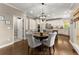 Charming eat-in kitchen featuring a round table, designer lighting, and stainless appliances at 4955 Winding Rose Dr, Suwanee, GA 30024