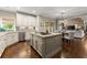 Well-appointed kitchen seamlessly connects to the living and dining areas at 4955 Winding Rose Dr, Suwanee, GA 30024