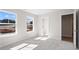 Spacious bedroom with plush carpeting and two windows overlooks new home construction at 910 Melody Ridge Ln, Buford, GA 30518