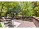 Inviting back deck with wood railing and room to relax with an outdoor seating arrangement at 1055 Woodland Se Ave, Atlanta, GA 30316