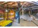 Unfinished basement with exposed brick foundation, utilities, and visible infrastructure at 1055 Woodland Se Ave, Atlanta, GA 30316
