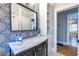 Stylish bathroom has decorative tile, a modern vanity, and a tile shower at 1055 Woodland Se Ave, Atlanta, GA 30316