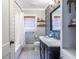 Charming bathroom with hexagon tile floors, patterned accent wall, and a bathtub with shower at 1055 Woodland Se Ave, Atlanta, GA 30316