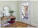 Bedroom details include a wooden desk, an accent chair, and access to the porch at 1055 Woodland Se Ave, Atlanta, GA 30316