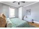 Bright bedroom boasts two windows, hardwood flooring, and an adjacent built-in at 1055 Woodland Se Ave, Atlanta, GA 30316