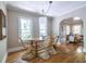 Cozy dining area featuring hardwood floors, natural lighting, and seating for four at 1055 Woodland Se Ave, Atlanta, GA 30316