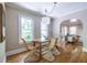 The dining area boasts hardwood floors, a wooden table, and seating for four at 1055 Woodland Se Ave, Atlanta, GA 30316
