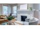 Bright living room featuring hardwood floors, a fireplace, and comfortable seating at 1055 Woodland Se Ave, Atlanta, GA 30316