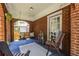 Relaxing front porch featuring a porch swing, seating area, and decorative plants at 1055 Woodland Se Ave, Atlanta, GA 30316