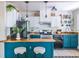 Charming kitchen with teal cabinets, white upper cabinets, and stainless steel appliances at 1055 Woodland Se Ave, Atlanta, GA 30316