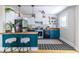 Stylish kitchen boasts teal cabinets, butcher block counters, and stainless steel appliances at 1055 Woodland Se Ave, Atlanta, GA 30316
