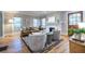 Bright living room featuring hardwood floors, a fireplace, and comfortable seating at 1055 Woodland Se Ave, Atlanta, GA 30316