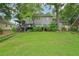 Expansive green backyard featuring a wooden deck and patio, perfect for outdoor gatherings at 177 Coopers Pond Dr, Lawrenceville, GA 30044