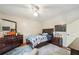 Cozy bedroom features hardwood floors, ceiling fan, and stylish decor at 177 Coopers Pond Dr, Lawrenceville, GA 30044