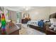 Cozy bedroom featuring a comfortable bed, dresser, and ample natural light, creating a welcoming space at 177 Coopers Pond Dr, Lawrenceville, GA 30044
